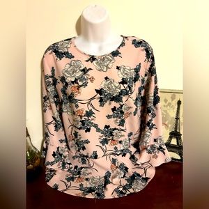 Suzy Shier flowery blouse with long butterfly sleeves.